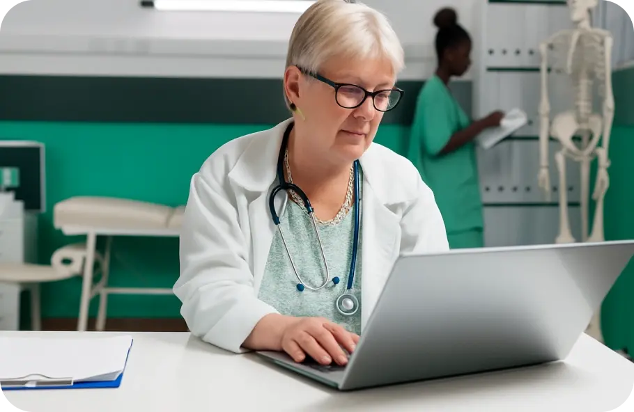 portrait-medic-with-stethoscope-using-laptop-work-healthcare-cabinet-woman-doctor-working-with-computer-technology-prescription-treatment-analysis-examination 1 (1)